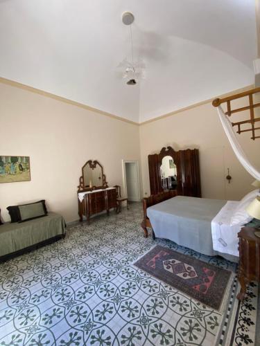 a bedroom with a bed and a staircase in it at Palazzo Rollo in Lecce