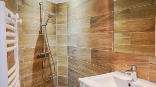 a bathroom with a shower and a sink at Les tamaris in La Londe-les-Maures
