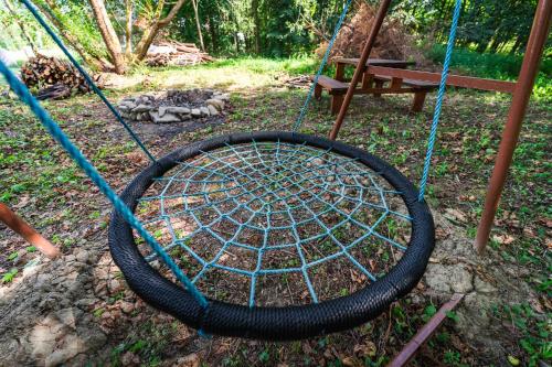 a tire in a swing set in a yard at Luxapart Golf Ostravice in Ostravice