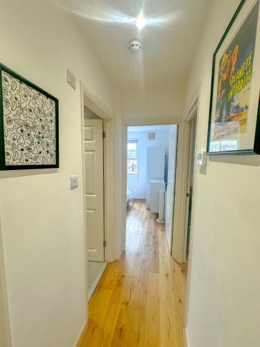 an empty room with a hallway with at Maple Street Apartments in London