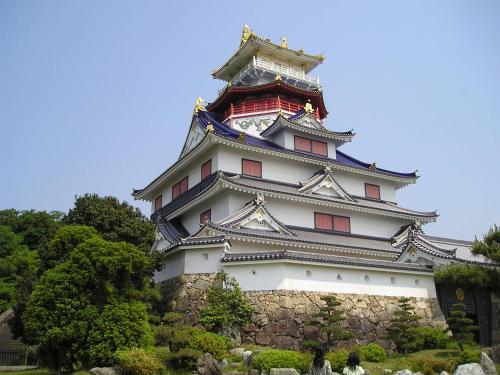 a large building with a tower on top of it at Ise-Shima Ohtaya Healing Stay in Toba