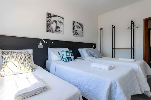 Giường trong phòng chung tại Guest House Iguatemi Campinas - Casa Perfeita
