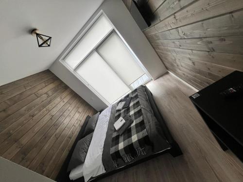 an overhead view of a bedroom with a large window at Готель WeLKoMe in Krivorovnya