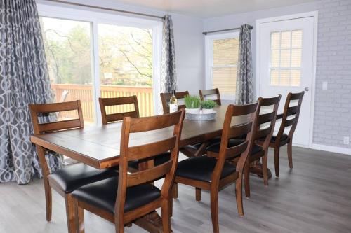 a dining room with a wooden table and chairs at Mimis Place making memories with your family in Mears