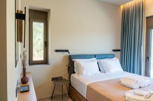 Ένα ή περισσότερα κρεβάτια σε δωμάτιο στο Nodeas Grande Villa