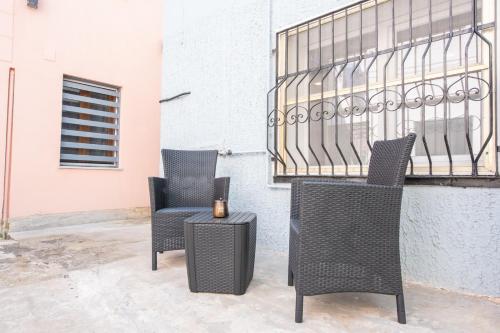 two chairs and a table on a patio at La Casetta in Comacchio
