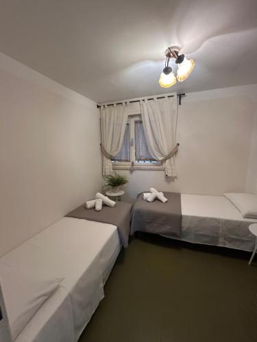 Postel nebo postele na pokoji v ubytování Miramare Apartment