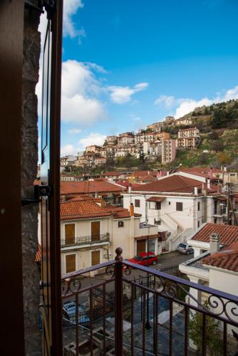 a view of a city from a balcony at Ξενώνας Οντάς και Spa in Arachova