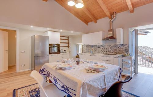 a kitchen with a table with wine glasses on it at Awesome Home In Albagnano Di Bee in Bee