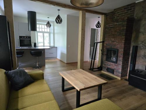 a living room with a couch and a fireplace at Endla appartement in Viljandi