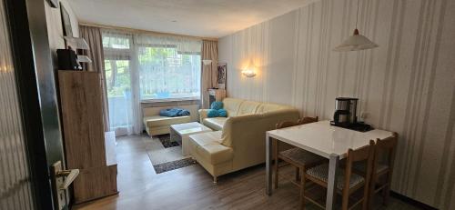 a living room with a couch and a table at Apartment 3 115 in Goslar