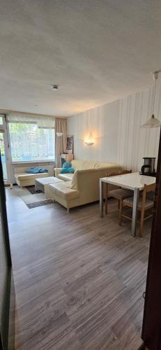 a living room with a couch and a table at Apartment 3 115 in Goslar