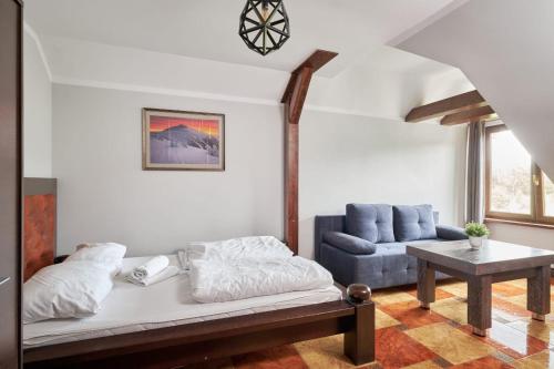 Katil atau katil-katil dalam bilik di Apartamenty EverySky Gasthaus Karpacz