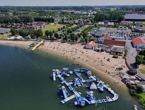 an aerial view of a beach with a water park at Holiday Suites Jabbeke - Klein Strand in Jabbeke
