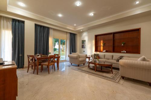 a large living room with a table and a couch at Jolie Ville Hotel & Spa Kings Island Luxor in Luxor