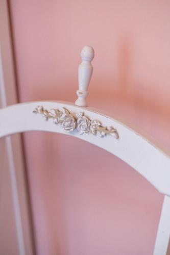 a white shelf with a figurine on it at La Vecchia Tenenza B&B in Città della Pieve