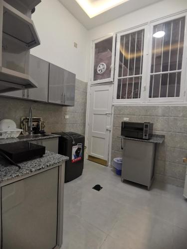 a kitchen with a sink and a counter top at family suites cairo downtown in Cairo