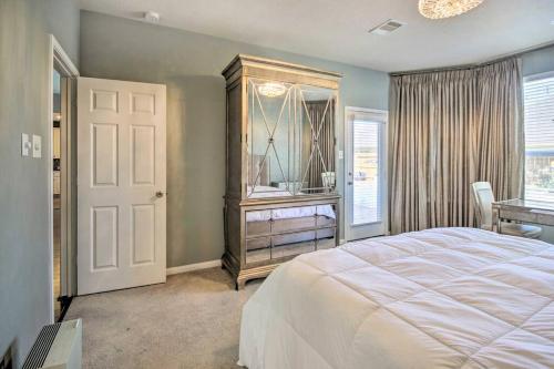 a bedroom with a bed and a dresser and a window at Serene 4BR Lux Home w Heated Spa Pool Massage Chair in Cypress