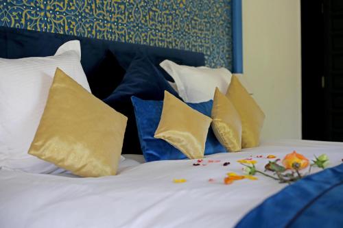 Cama o camas de una habitación en Domaine DAR JMEL & Dar Abi Samama