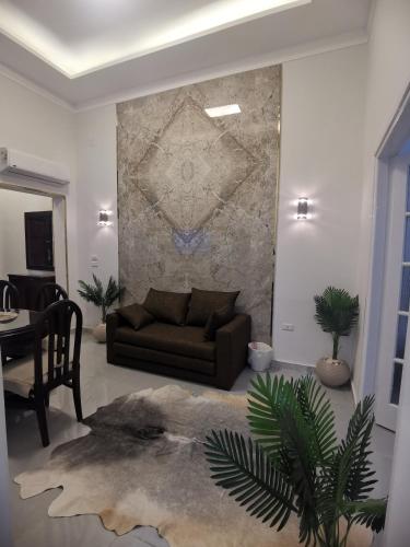 a living room with a couch and a table at family suites cairo downtown in Cairo