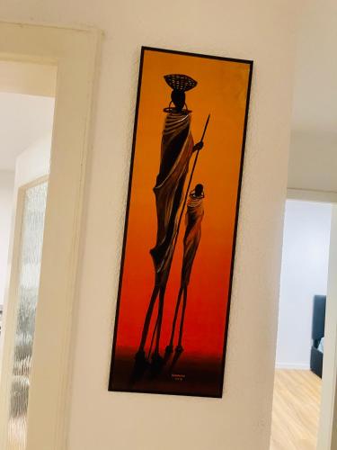 a painting of two women on a wall at GraceHomes - Garage, Ventilator, Free Coffee, Airport, Messe, Stuttgart, WiFi up to 6 Guests in Leinfelden-Echterdingen