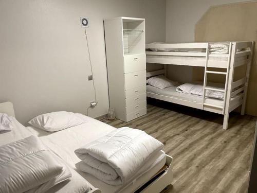 Postel nebo postele na pokoji v ubytování Gîte Ferme équestre