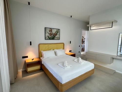 a bedroom with a large bed in a room at Ashta Suites - Nora Suite in Fethiye