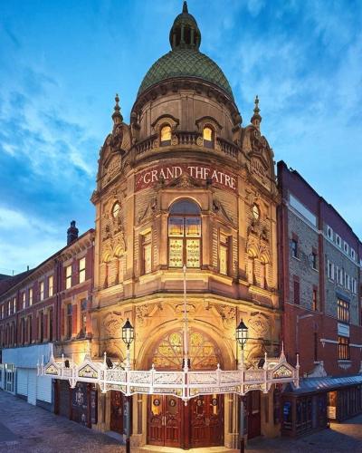 a building with a sign on the front of it at The Bailey Hotel Blackpool in Blackpool