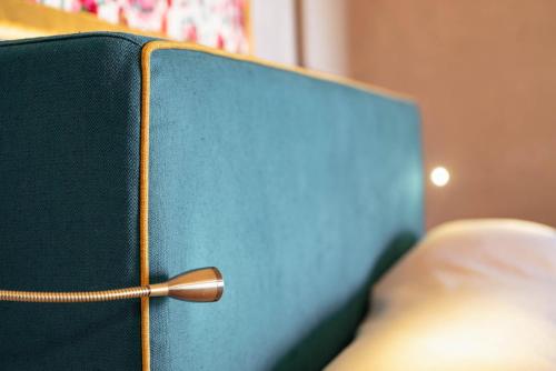 a green cabinet with a wooden knob on it at Guadalupe Tuscany Resort in Braccagni