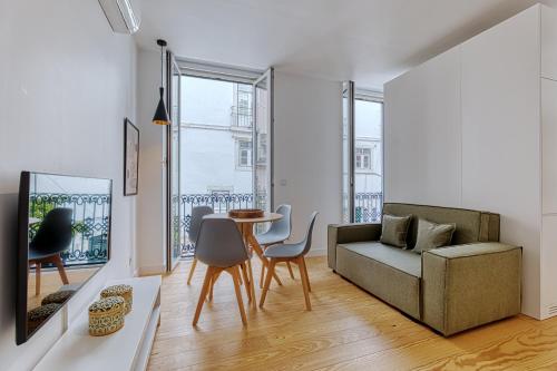a living room with a couch and a table at InLoveApartments - Luxury in Alfama in Lisbon