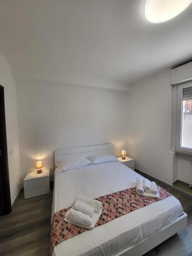 a bedroom with a bed with two towels on it at Partenope in Termoli