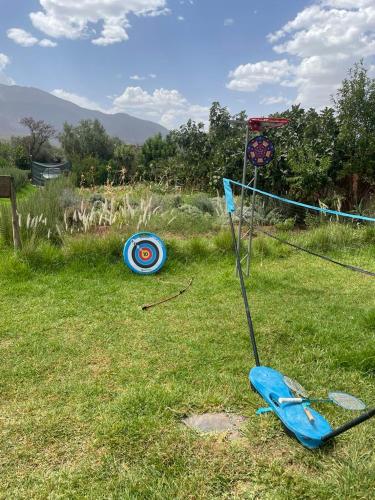 a frisbee golfournament in a field with a goal at Ferme Tibrijine in Marrakech
