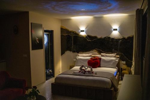 a bedroom with a bed with two stuffed animals on it at Dolce Vita, Spa, Cagnes Sur Mer in Cagnes-sur-Mer
