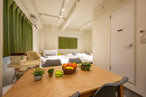 a room with a table with fruit on it at Hanarai Asakusa in Tokyo