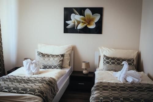 Un pat sau paturi într-o cameră la Apartmany Fonte