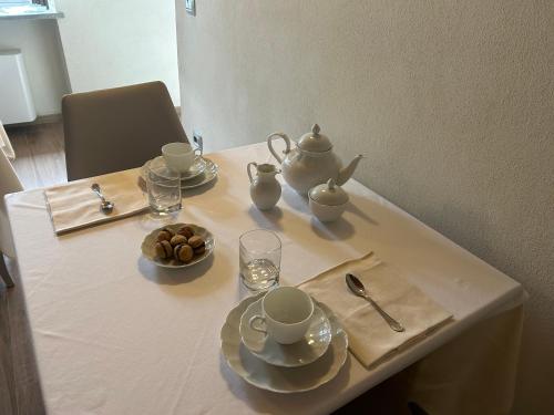 a table with a tea set on top of it at Vin dell'Olmo in Castagnole Lanze
