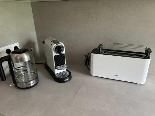 a toaster and coffee maker sitting on a counter at Lindenhof Michaelis - Urlaub auf dem historischen Gutshof in Liebstadt