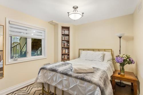 a bedroom with a bed and a window at Cozy 1-BR, with Private Patio in Vaughan