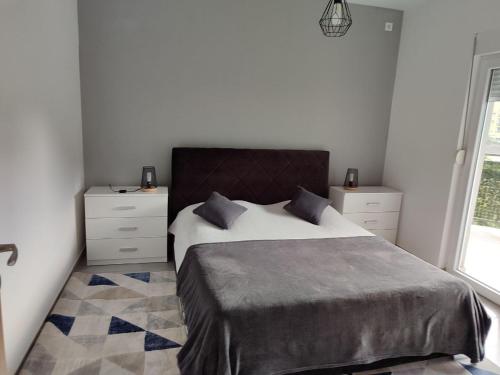 En eller flere senge i et værelse på BOKI apartments