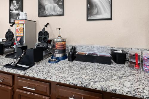 a kitchen with a counter top with a appliance on it at Super 8 by Wyndham Bridgeport/Clarksburg Area in Bridgeport