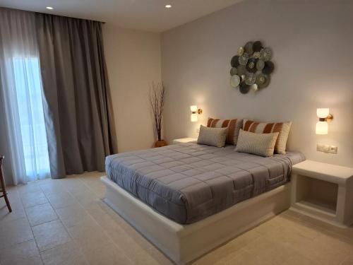 Ένα ή περισσότερα κρεβάτια σε δωμάτιο στο Tsigouri Suites