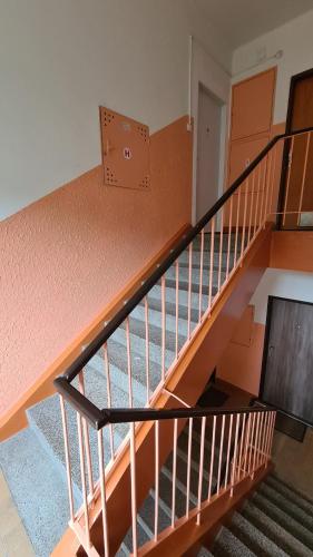 an empty staircase in a building with a stair case at Apartmán Sokolovská in Karlovy Vary