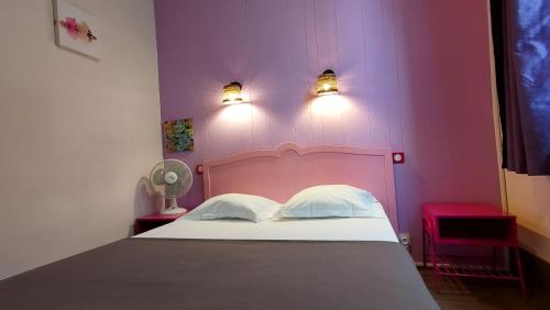 Una cama o camas en una habitación de Hotel Le Colibri