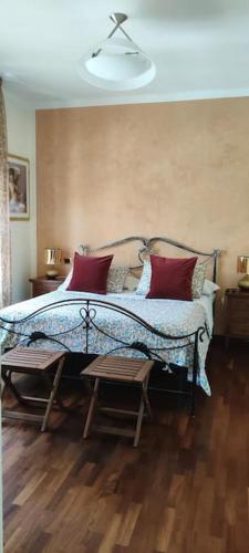 a bedroom with a bed with red and white pillows at The Place - Splendido bilocale in centro con box auto in Civitanova Marche