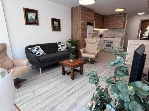 a living room with a couch and a table at Luxury Family Levante Beach in Benidorm