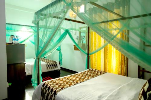 Cama o camas de una habitación en Village Star Rest-Mirissa