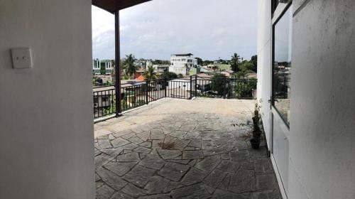a view of a patio from a balcony at Luxury 1 Bed Room Suite in Boralesgamuwa
