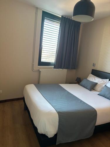 Postel nebo postele na pokoji v ubytování Résidence des Portes du Velay