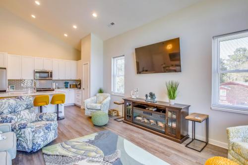a living room with a couch and a table at Carolina Beach Vacation Home Near Boardwalk in Carolina Beach