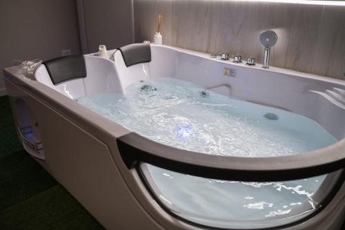 a jacuzzi tub filled with water in a bathroom at Casa Magnolia in Foggia